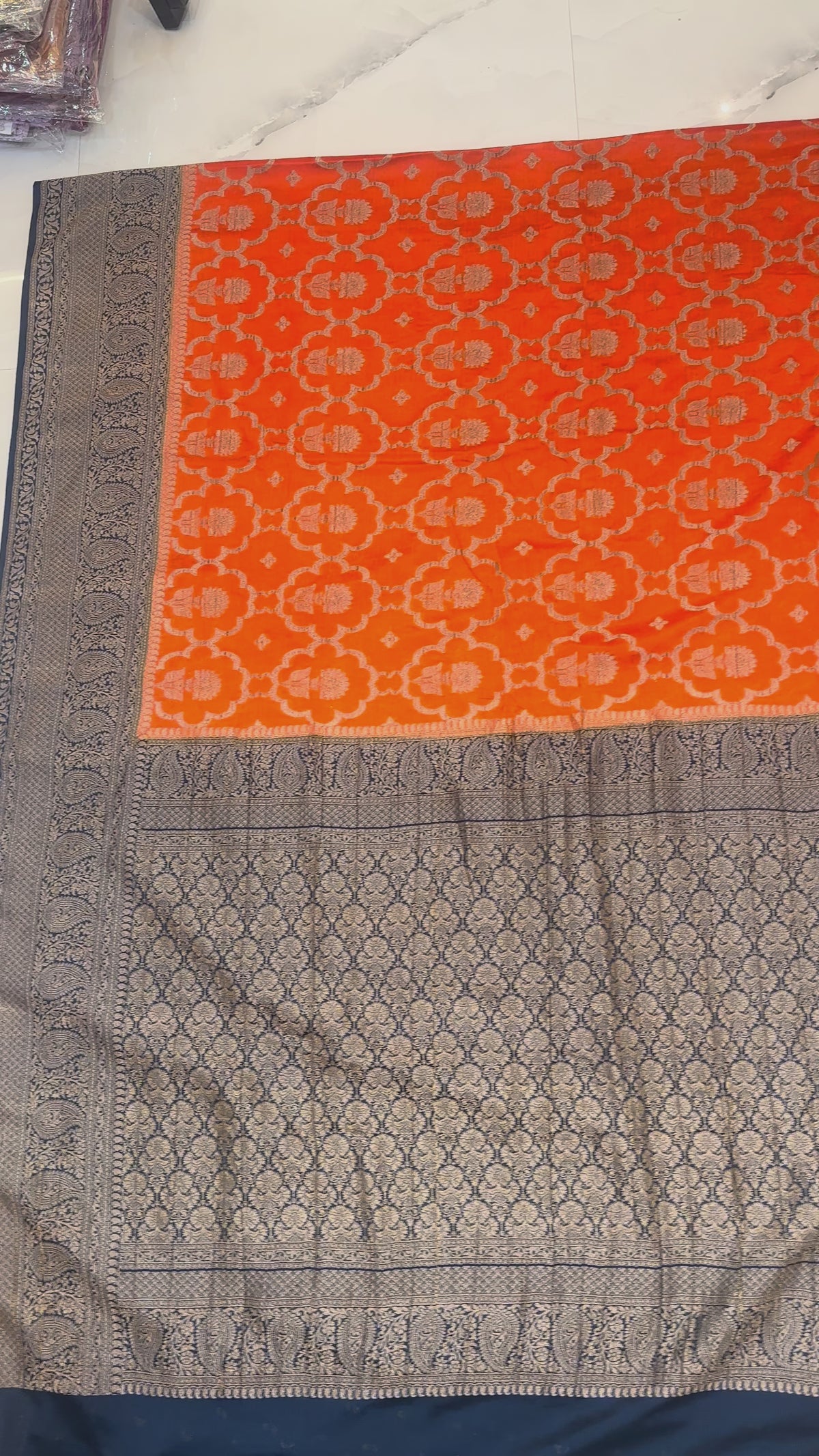 Rust Orange Banarasi Georgette Saree with Antique Zari Floral Jaal and Navy Contrast Border